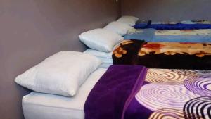 Letto o letti in una camera di Gite Dar Tanzoughte