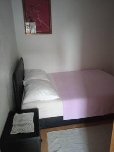 Postel nebo postele na pokoji v ubytování Apartments Suco
