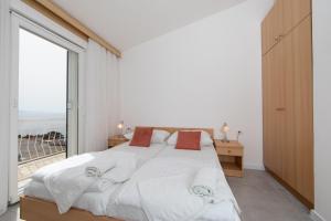 Ένα ή περισσότερα κρεβάτια σε δωμάτιο στο Apartments Klaricic