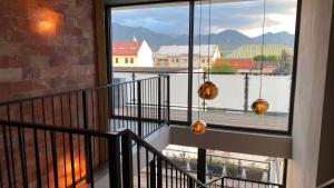 a balcony with a view of the mountains at Aparthotel Central Liptovský Mikuláš in Liptovský Mikuláš