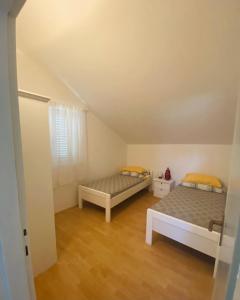 Postel nebo postele na pokoji v ubytování Apartments 'Stine'