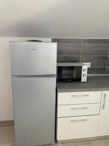 Kuchyň nebo kuchyňský kout v ubytování Apartments 'Stine'