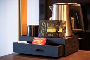 a box with a coffee cup and a book on it at The Grafton Hotel in Dublin