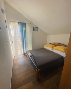 Postel nebo postele na pokoji v ubytování Apartments 'Stine'