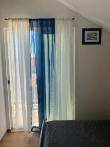Postel nebo postele na pokoji v ubytování Apartments 'Stine'
