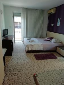 Postel nebo postele na pokoji v ubytování Art Guest House Orchidea
