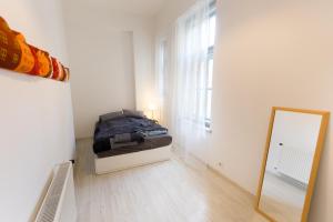 Postel nebo postele na pokoji v ubytování Palace District Apartment