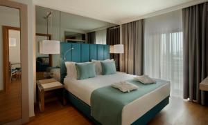 Cama ou camas em um quarto em TURIM Presidente Hotel