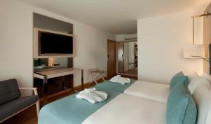 Cama ou camas em um quarto em TURIM Presidente Hotel