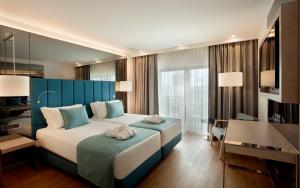 Cama ou camas em um quarto em TURIM Presidente Hotel