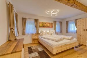 Ένα ή περισσότερα κρεβάτια σε δωμάτιο στο Ferienhaus Wagnerfranzl +36 φωτογραφίες
