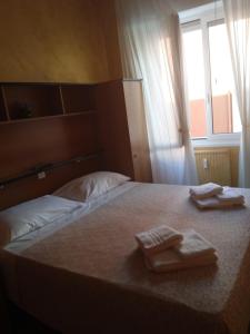 Voodi või voodid majutusasutuse Albergo Stella Di Mare toas