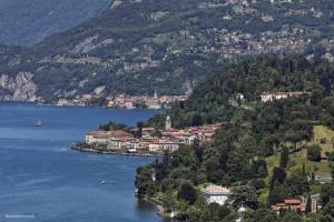 a view of a lake with a town on a mountain at Antichi Sapori Apartment One in Bellagio