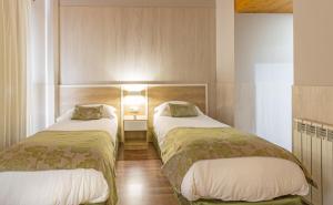 Säng eller sängar i ett rum på Hotel Princesa Parc