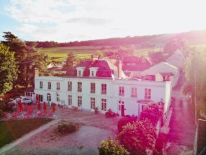 an aerial view of a large white house at Logis Hôtel & Restaurant Chateau de la Marjolaine in Essômes-sur-Marne