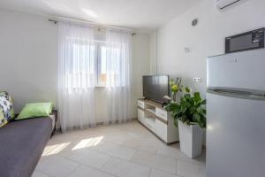 Kuchyň nebo kuchyňský kout v ubytování Apartments Rogić