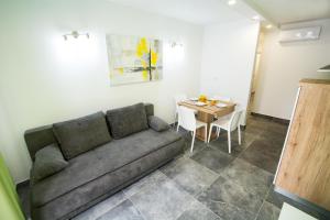 a living room with a couch and a table at Eluize Inn Dubrovnik in Dubrovnik