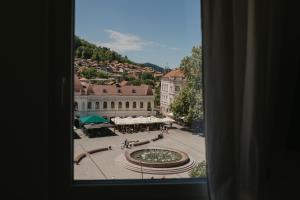 a view of a city from a window at Akro Studio apartman in Tuzla