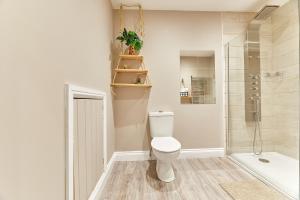 a bathroom with a toilet and a shower at Host & Stay - The Pepper Pot in Alnwick +3 photos