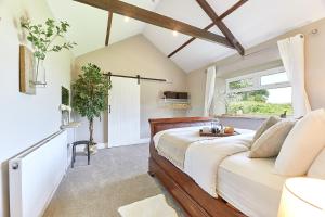 a bedroom with a bed and a window at Host & Stay - The Pepper Pot in Alnwick +4 photos