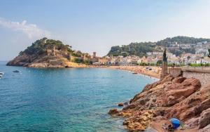 a view of a beach with people on the shore at Tossa Beach Center in Tossa de Mar