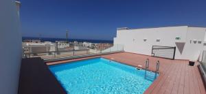 a swimming pool on the roof of a building at Bendito Viento in Tarifa