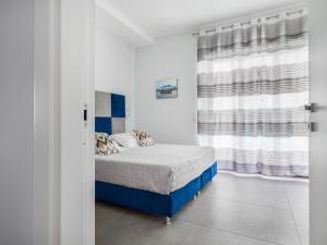 Posteľ alebo postele v izbe v ubytovaní Azzurro Park Suite - De Vivo Realty Sorrento