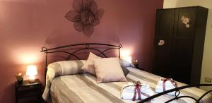 a bedroom with a bed with two bags on it at Saint Peter Vatican City Large Apartment Barbara casa vacanza in Rome
