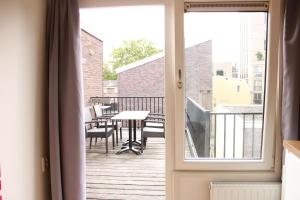 Balkón nebo terasa v ubytování HOLT Hotel