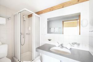 Koupelna v ubytování Hotel Alpina