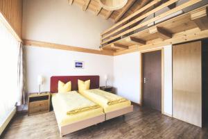 Postel nebo postele na pokoji v ubytování Hotel Alpina