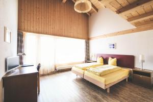 Postel nebo postele na pokoji v ubytování Hotel Alpina