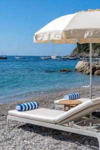 a beach chair sitting on top of a sandy beach at Borgo Santandrea in Amalfi