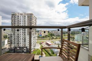 a balcony with a view of a city at Albatross Towers Przymorze Apartments by Renters in Gdańsk