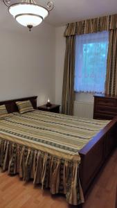 Posteľ alebo postele v izbe v ubytovaní Mona apartment