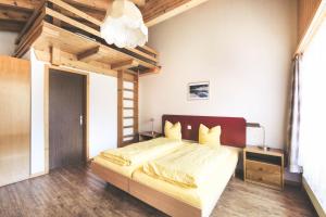 Postel nebo postele na pokoji v ubytování Hotel Alpina