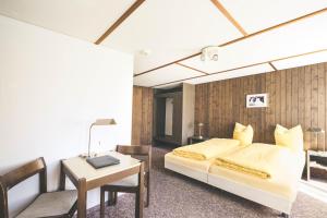 Postel nebo postele na pokoji v ubytování Hotel Alpina