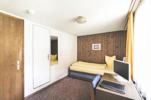 Postel nebo postele na pokoji v ubytování Hotel Alpina