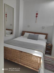 Posteľ alebo postele v izbe v ubytovaní White cycladic town house with sea vew