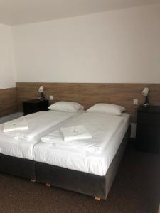 Postel nebo postele na pokoji v ubytování Motel R10