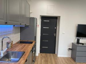 Kuchyň nebo kuchyňský kout v ubytování Apartment in city center 2