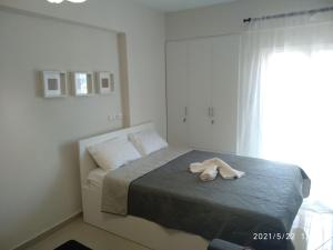 Postel nebo postele na pokoji v ubytování Little Beauty - HappyHostGr - in Platamonas