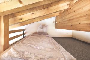 Postel nebo postele na pokoji v ubytování Hotel Alpina