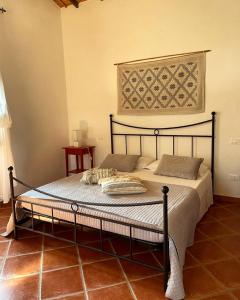 מיטה או מיטות בחדר ב-La Vecchia Fornace