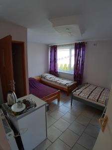 Postel nebo postele na pokoji v ubytování Pokoje Gościnne Zacisze