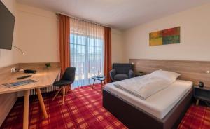Postel nebo postele na pokoji v ubytování Danner´s Hotel Löwen + 20 fotografií