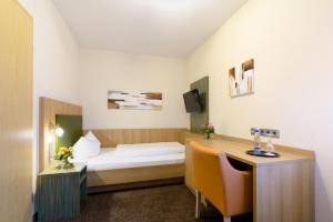 Postel nebo postele na pokoji v ubytování Danner´s Hotel Löwen