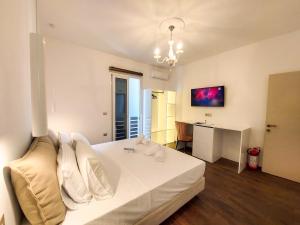 Posteľ alebo postele v izbe v ubytovaní Polymnia Luxury Apartments Argostoli