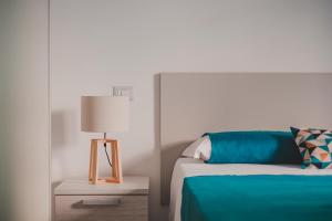 A bed or beds in a room at Dreamers' House Sorrento