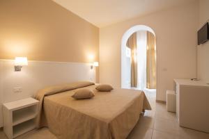 Кровать или кровати в номере Hotel Falcone